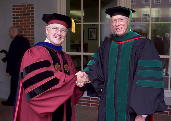Arthur Clements and Ocie Harris shake hands