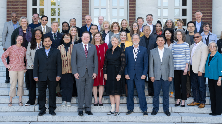 Group photo of GEDF attendees on an outdoor staircase
