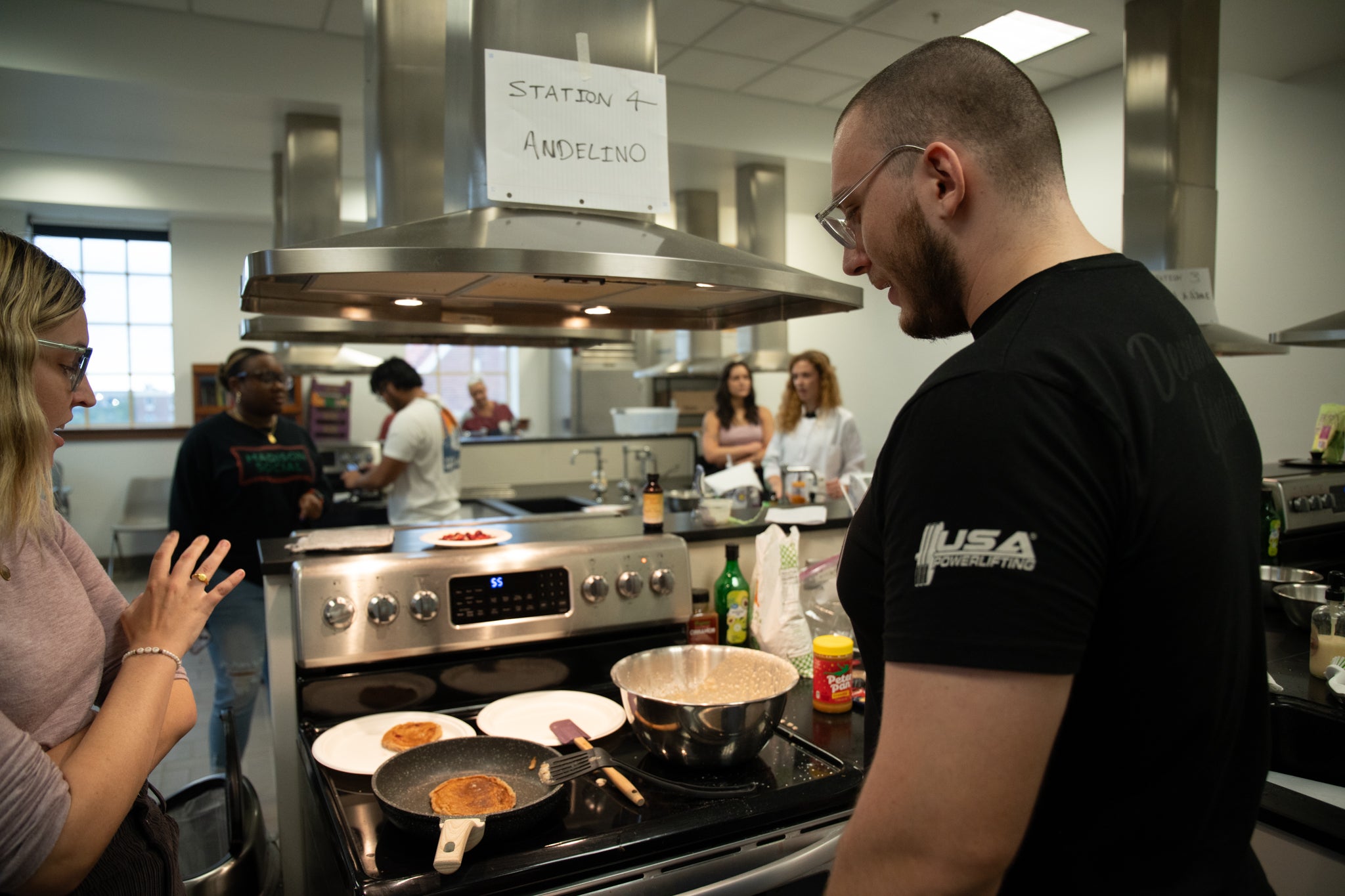 Students cooking on a stovetop